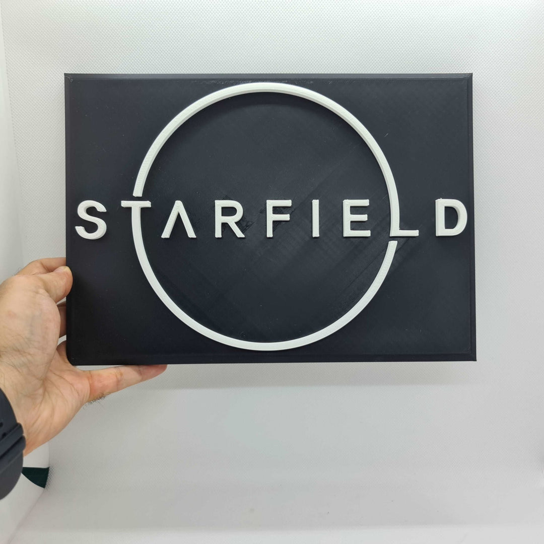 Cartel 3D del Logo de Starfield - Embárcate en una Aventura Galáctica