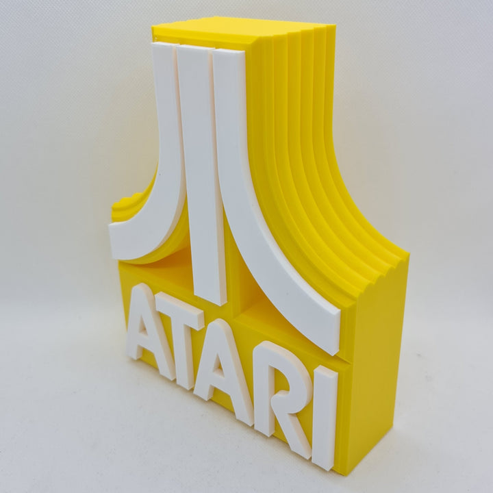 Cartel de sobremesa Atari: Un Viaje Retro al Mundo de los Videojuegos