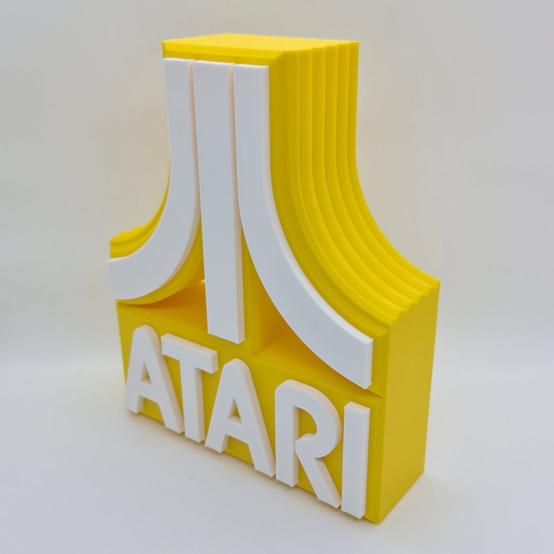 Cartel de Atari: Un Viaje Retro al Mundo de los Videojuegos